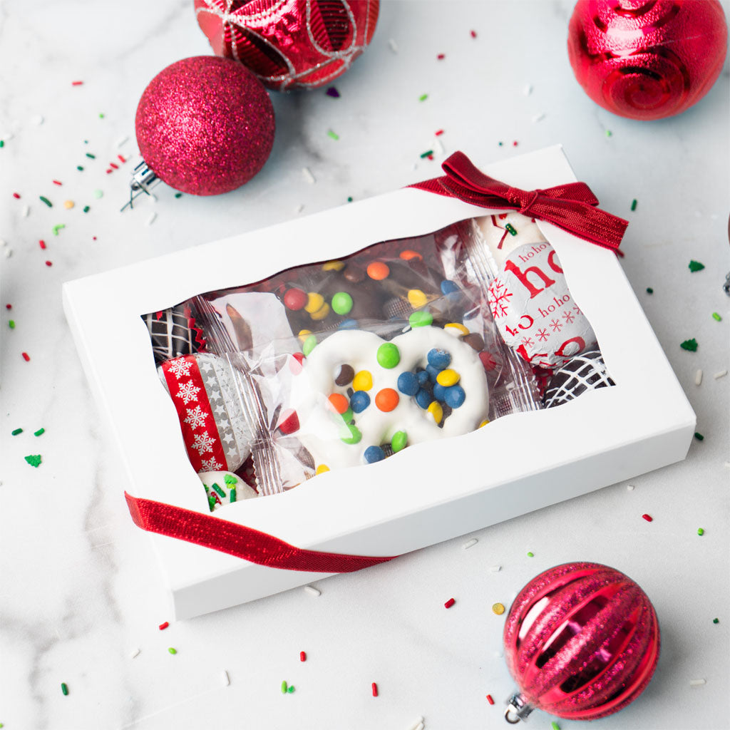 Gift box filled with chocolate-covered holiday pretzels