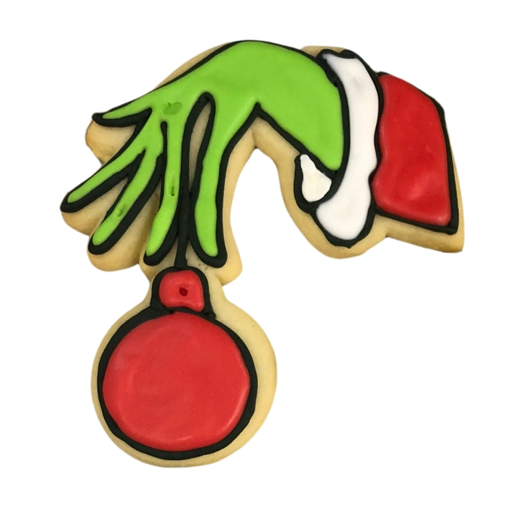 Grinch hand ornament cookie with red and green icing.